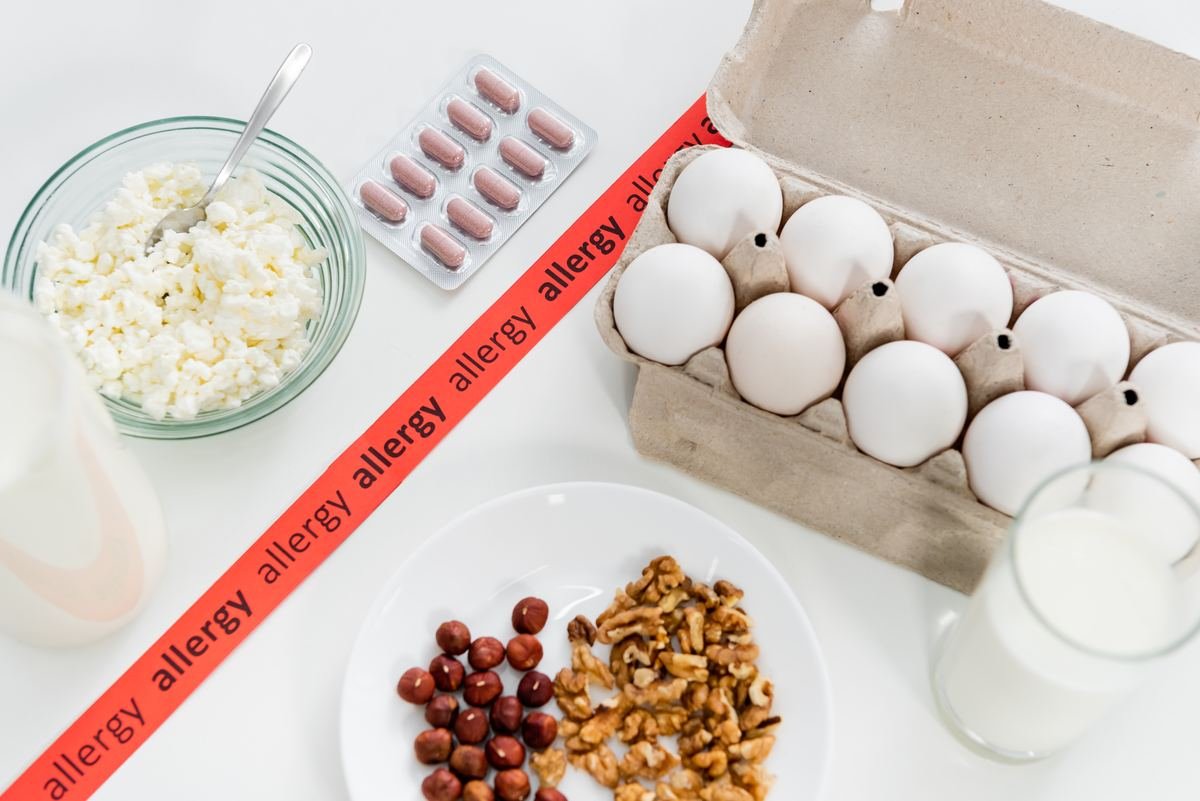 Foods and pills illustrating food allergy and intolerance